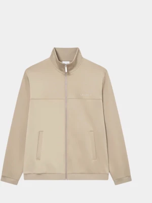 Beige vindjacka från Les Deux - Stilren beige vindjacka från Les Deux med hög krage och diskret logga på bröstet. Jackan har dragkedja framtill, två sidofickor och raka ärmar. Tillverkad i ett mjukt syntetmaterial som ger en clean look.