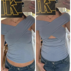 Ljusblå offshoulder omlottopp - Säljer en snygg ljusblå topp som är offshoulder och har omlott över brösten. Toppen går att ha på två olika sätt. Den passar till typ allt och höjer din outfit ett steg till!🩵