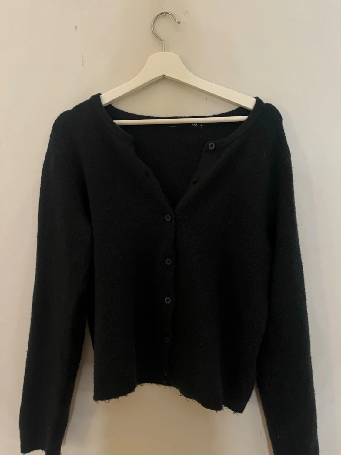 Svart kofta med knappar