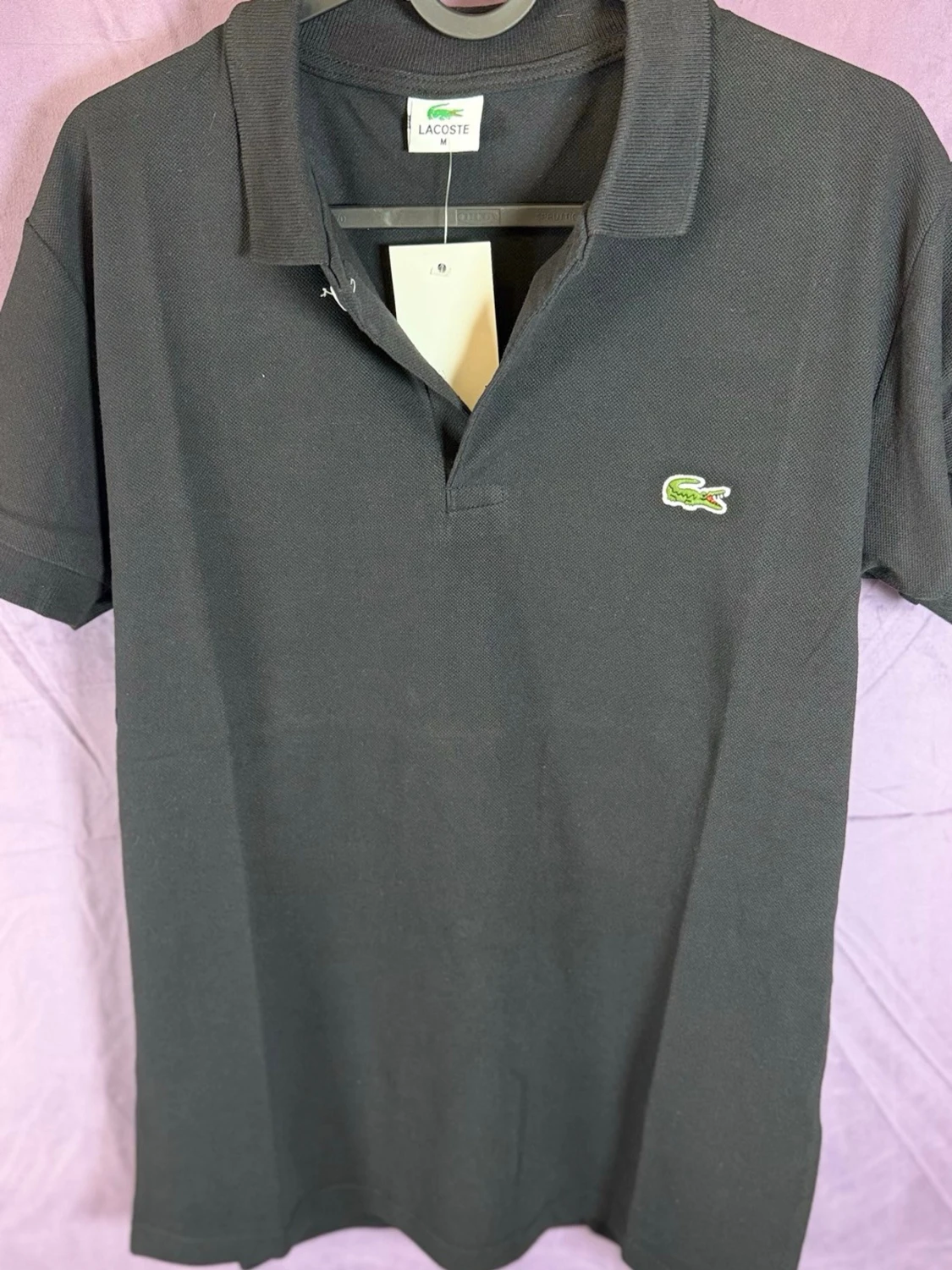 Svart pikétröja från Lacoste - 1