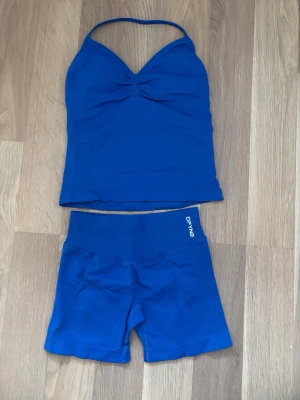 Dfyne  - Storlek S modellen impact färgen Deep sea