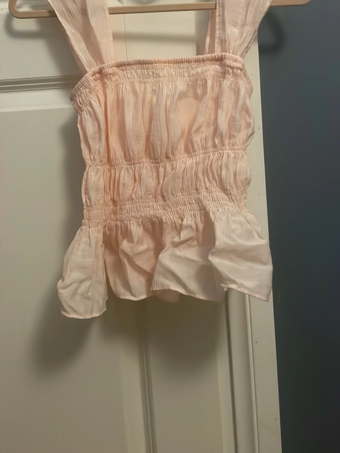 Ljusrosa ärmlös linnetopp