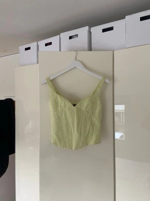 Gulgrön rutig korsettopp - Gulgrön korsettopp med dragkedja 