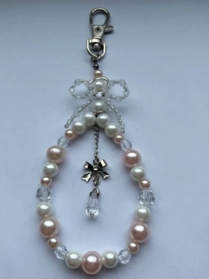 Nyckelring/bag charm med rosett🎀 - Nyckelring/bag charm med rosett, gjord av mig💕