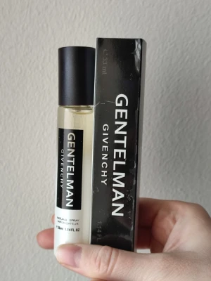 Givenchy Gentleman - Givenchy Gentleman Perfume. 33ml bottle. New! Has some flaws on the front of the box that you can see in the pictures.