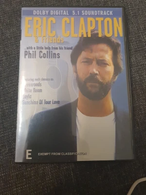Eric Clapton & Friends konsert-DVD - Konsert-DVD med Eric Clapton & Friends, där Phil Collins gästar. Omslaget är färgglatt med stor gul text och artistfoto. Innehåller klassiska låtar som Crossroads, White Room och Layla. DVD-format med Dolby Digital 5.1 ljud och information på engelska.