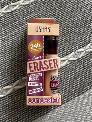 USHAS Full Cover Eraser Concealer - USHAS Full Cover Eraser Concealer i nyans 07. Flytande concealer med långvarig effekt upp till 24 timmar och är vattenfast. Kommer i en beige och lila förpackning med praktisk applikator. Perfekt för att täcka mörka ringar och ojämnheter.