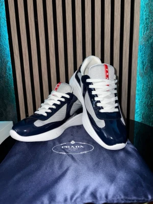 Prada cups- Royal Blue - Prada cups, worn only a few times. Brand new Size: EU 44 Color: Royal Blue Dust bag: Included Shoe box: Not included                                         Price: Can be discussed