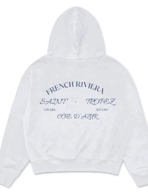 Vit hoodie från Civaré ( French riviera collection) - Snygg vit hoodie från Civare Studio med tryck i marinblått på ryggen där det står 'French Riviera Saint-Tropez Côte d'Azur'. Klassisk känguruficka framtill och liten logga på bröstet. Tillverkad i mjuk bomullsblandning och har huva.
