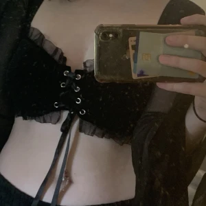 Svart topp - Svart topp med fladdermus ärmar