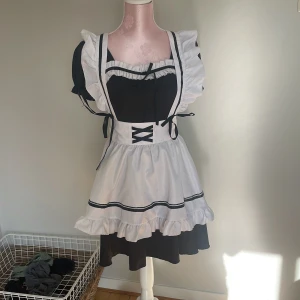 Maid dress  - I have only used it 3 times .I got it at närcon last year.it also comes with a headpeace and some accessories 