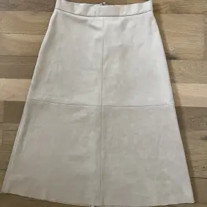 A-line midi skirt in imitation suede.   Brand new with tag   Size 36