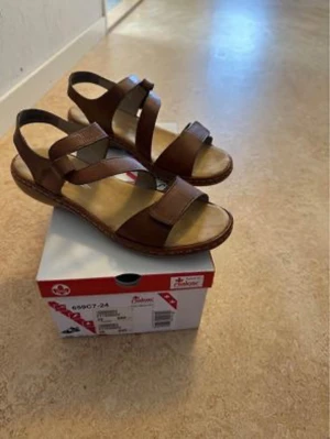 Shoes - New shoes sell ​​them for half the original price nearly Brown sandal Rieker origana 399kr Navey Rieker 399kr You kan see the origanal prise on the box 