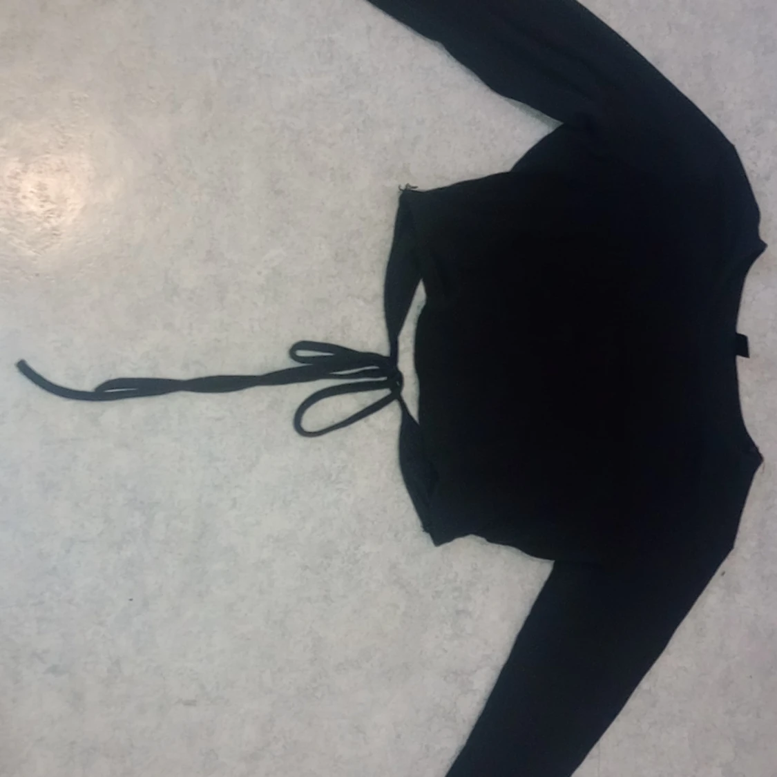 Topp med knyten rygg