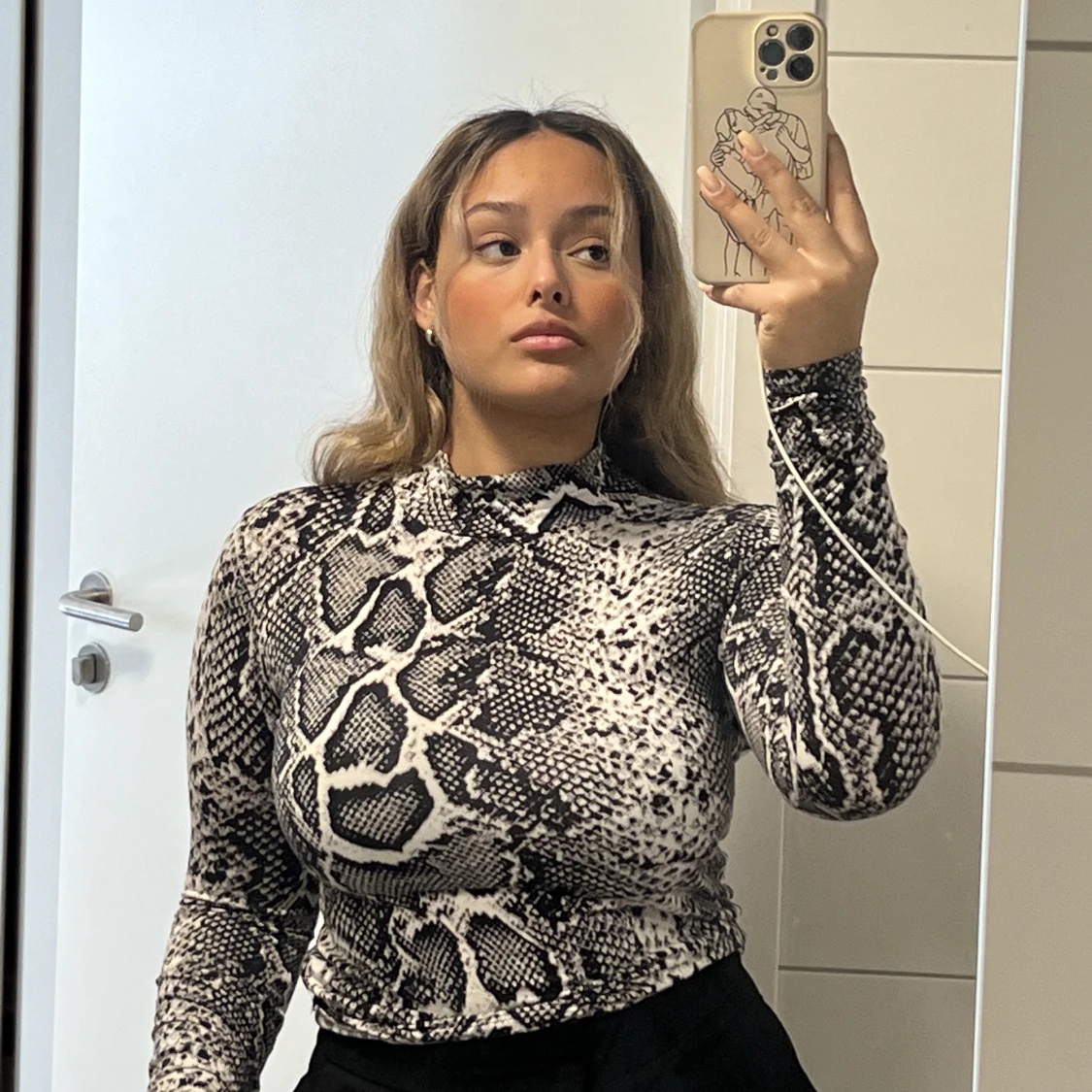 Tunn orm-inspirerad polo - 91