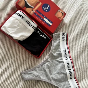 New Tommy Hilfiger thongs - Set of 3 thongs.  New. The sizing is a bit off, on the label it says size L but they are really tiny so i would say size S. 