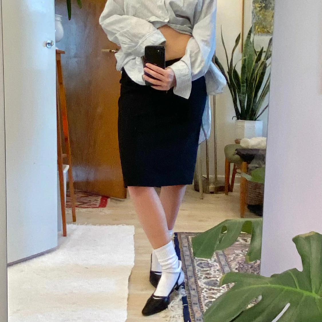 Lågmidjad svart kostym kjol