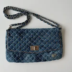 Denim purse with rhinestone details. You can wear the strap double like in the picture, or make it longer. 