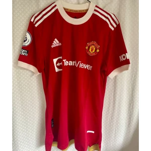 Manchester United Football Jersey  - Manchester United Fotboll hemmatröja säsong 2021/2022 med Ronaldo Icone på rygg 
