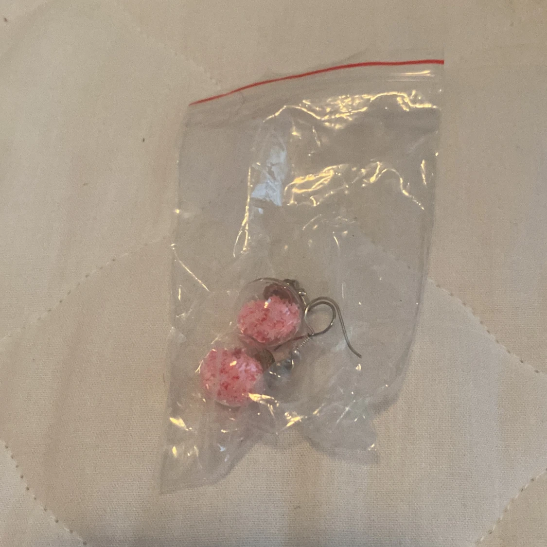 Rosa örhängen med pärlor