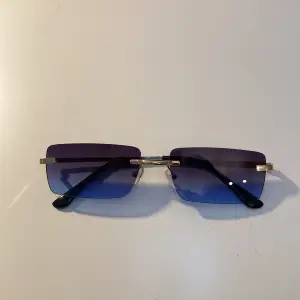 Blue sunglasses that haven’t been used