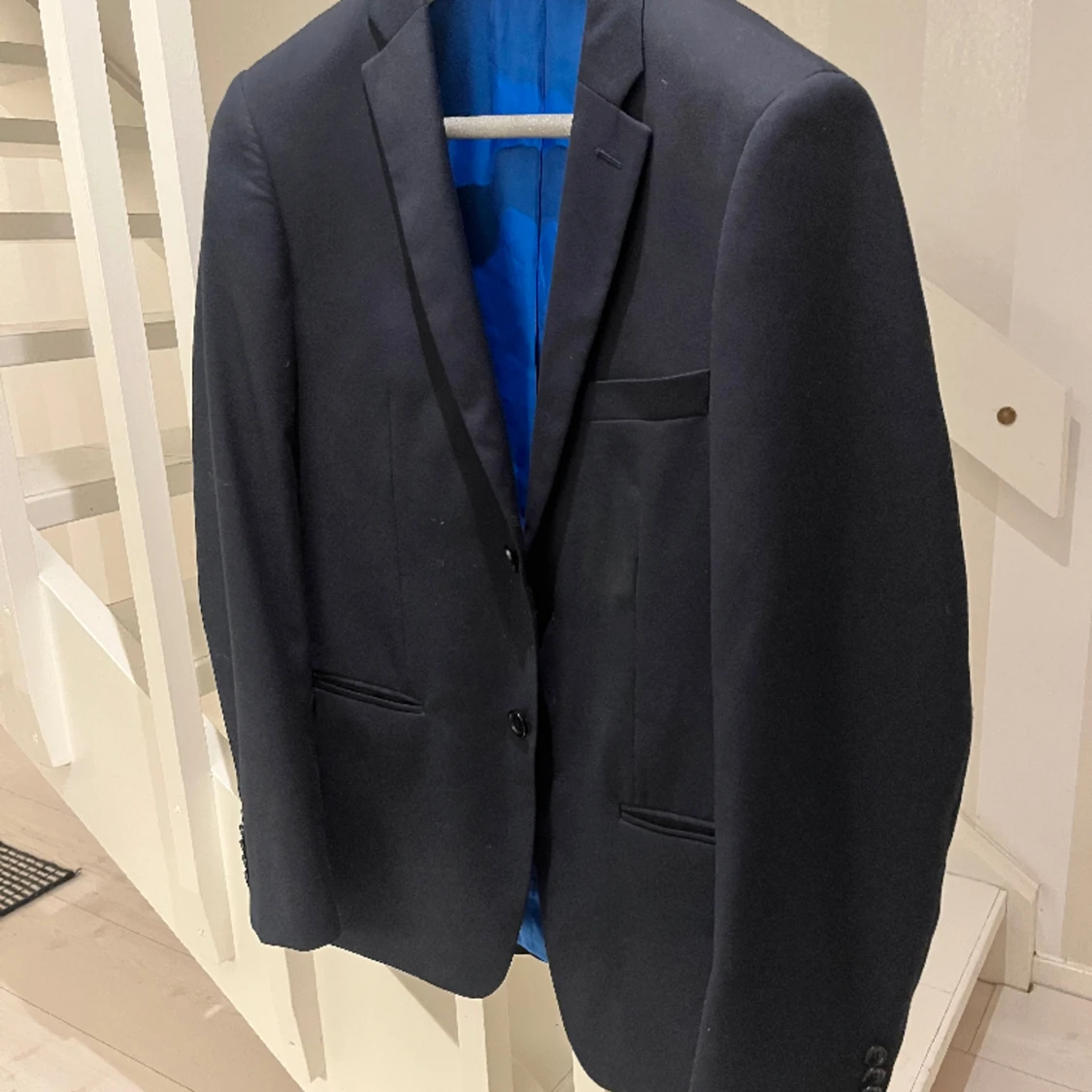 Blå kostym överdel
