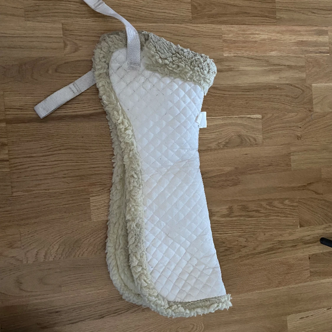 Fårskinnspadd till häst