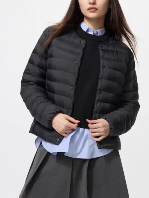 Svart dunjacka från Uniqlo  - Nypris 750kr. Mer som en M än L