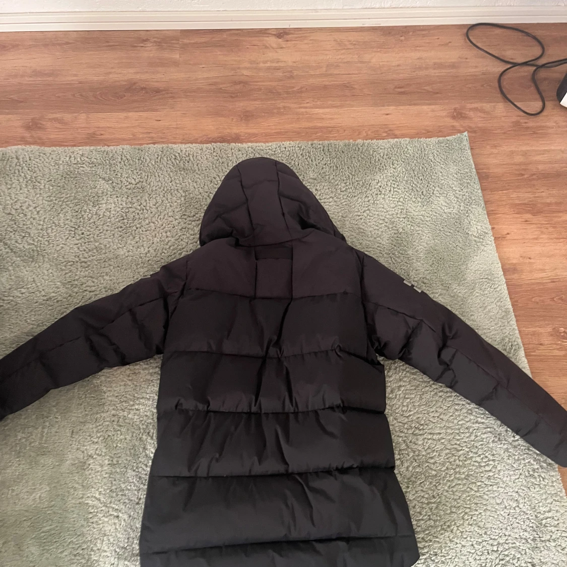 Svart dunjacka från Sail Racing - 2