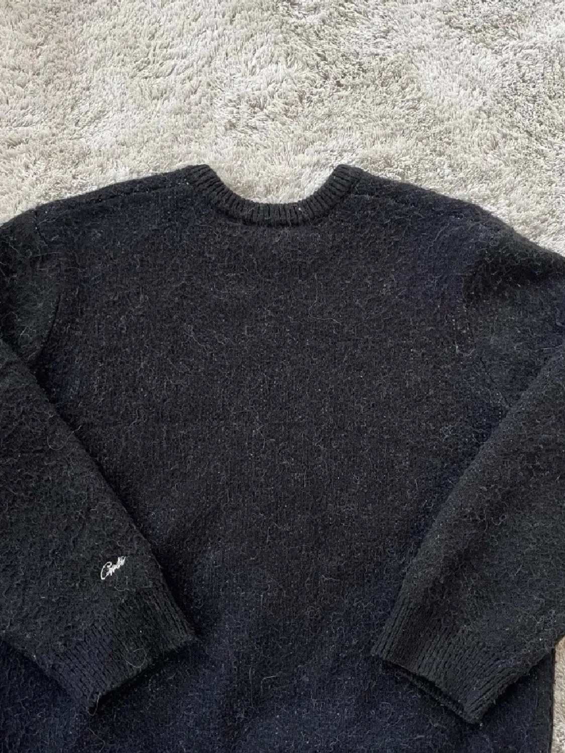 Svart stickad tröja med stjärna från Corteiz - 1