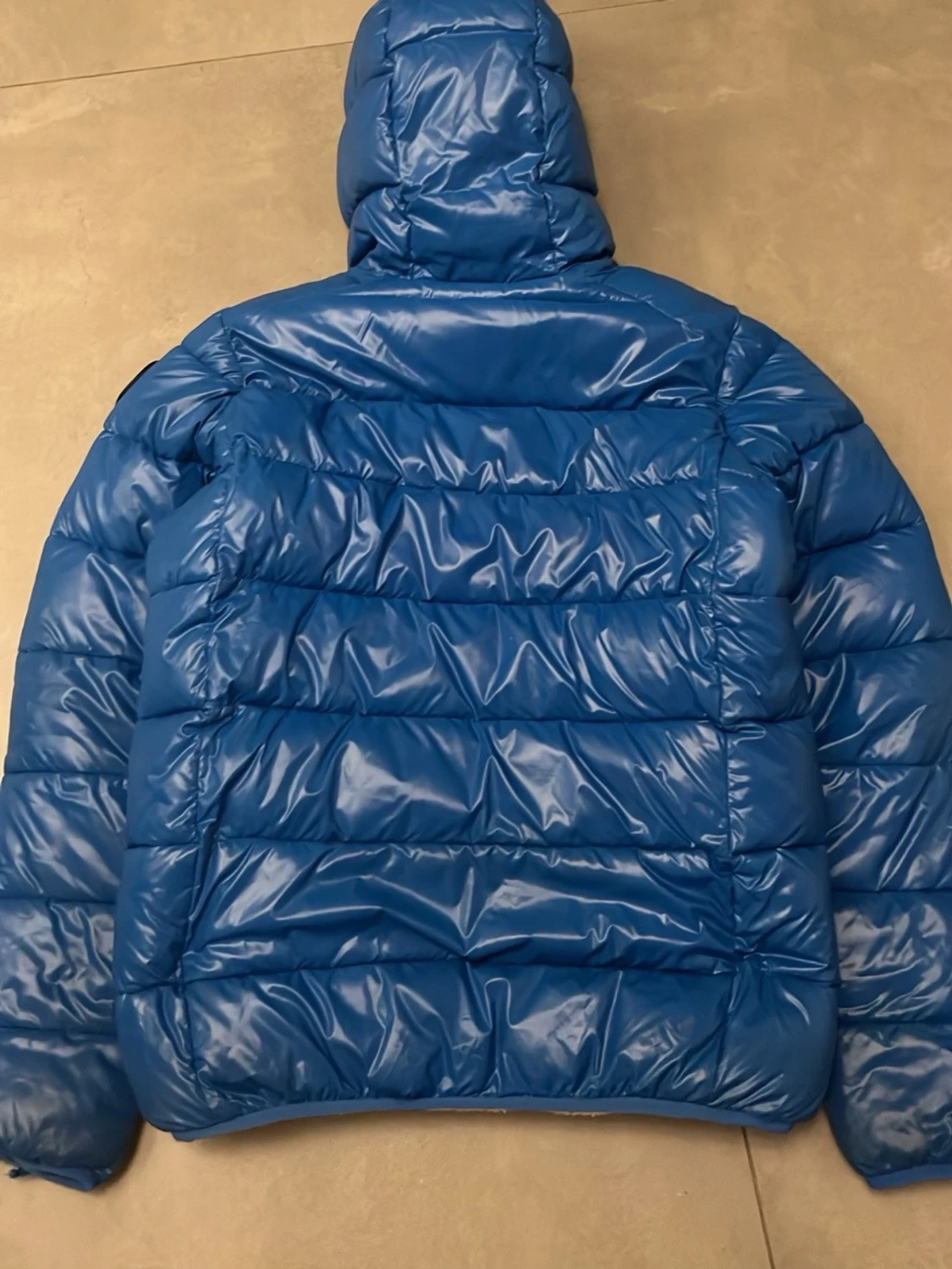 Blå pufferjacka med huva - 1