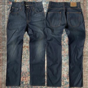 Nudie jeans Slim Jim  - Sjukt snygga jeans från Nudie i modellen Slim Jim i mycket fint skick 🙌 Skriv vid fråga 👍 storlek 31/32 A: 39cm B: 106cm