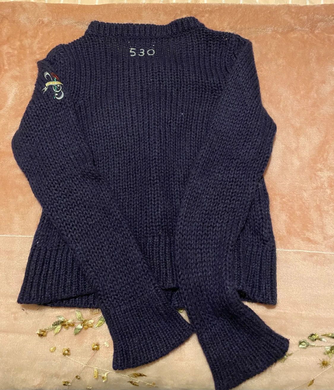 Mörkblå kofta från Odd Molly med rosetter i storlek 0 - 4