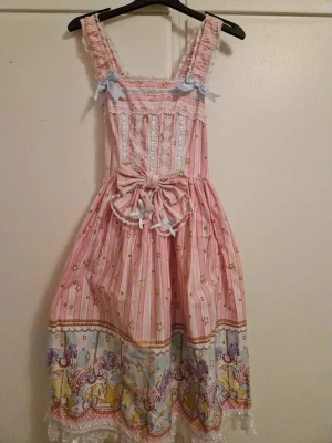 Pink lolita dress - Cutest lolita dress everr, perfect condition, it has carousel pattern in blue and purple and its from bodyline!🎀