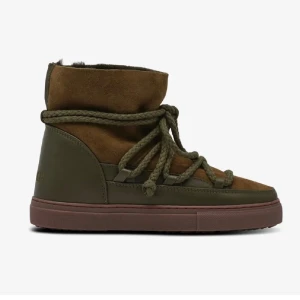 Inuikii classic boots gröna vinter skor - Inuikii classic boots i en grön khaki färg , vinterskor perfekta nu till vintern. Slitna (visas på bilderna) men har fortfarande mycket kvar att ge! Storlek 37! Skickas i orignalkartongen!
