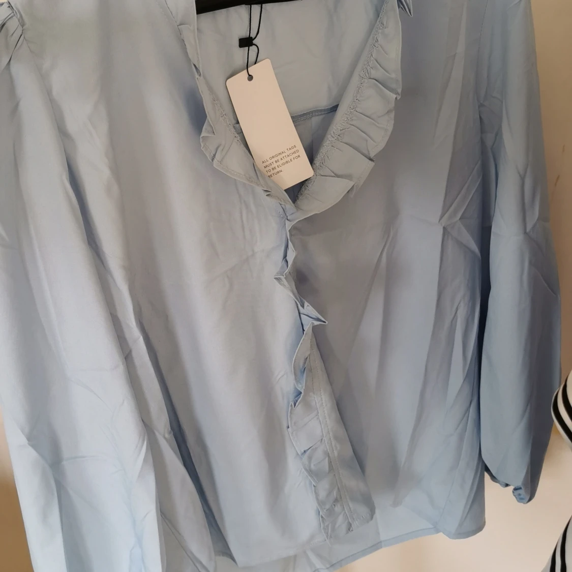 Ny ljusblå blus, size M