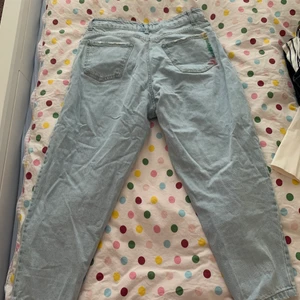 High waist curved leg jeans - Bought in the summer and wore them twice. They are like new. Selling them because they no longer fit me. 