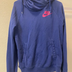 Nike Sweatshirt M  -  Blue and pink Nike sweatshirt. Baggy hoodie style. Size M