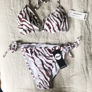 Bikini - Oanvänd bikini som inte kommer komma till användning då de inte är min stil. Hygienlappen är kvar på trosorna🦋 Strl 38 på överdelen och strl 36 på underdelen