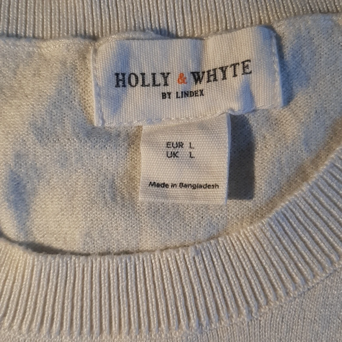 Somrig väst i en off white färg  - 90