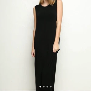 PRELOVED Brandy Melville / John Galt Black Maxi Muscle Tank Dress Big Armholes Scoop Neck XS S M - This very soft lightweight woven stretch maxi dress round neck and deep arm holes. Raw unfinished hems around ankle and arm holes. Ankle length. Narrow but loose fit. No side slits.   Cotton / Modal mix Tag size : OSFA "One Size Fits All"  Worn once & line dried, NOT machine dried. Moderately used great  condition. No holes, tears, rips, stains. Some pilling. Price reflects this. Smoke and pet free storage space. No other flaws to note. Itchy label tags have been carefully cut off but garment care tag still intact.   Happy to bundle. Will gladly take more pics.   Disclaimer: Please expect some general wear in all secondhand pre-owned items as they have lived a previous life, so do not expect a mint item.