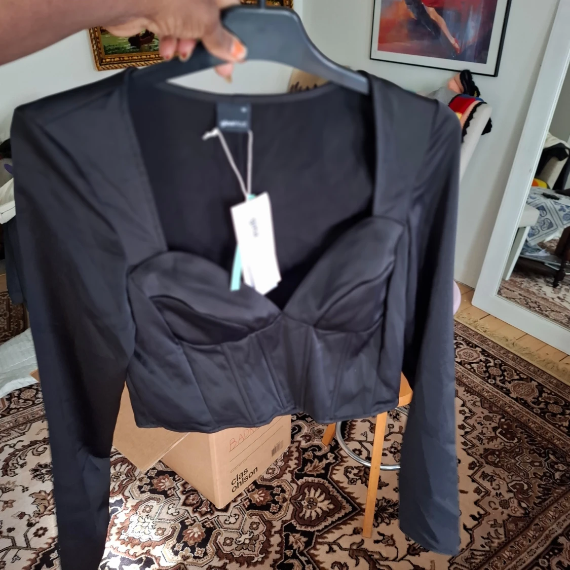 Svart långärmad korsettopp från Gina Tricot - 1