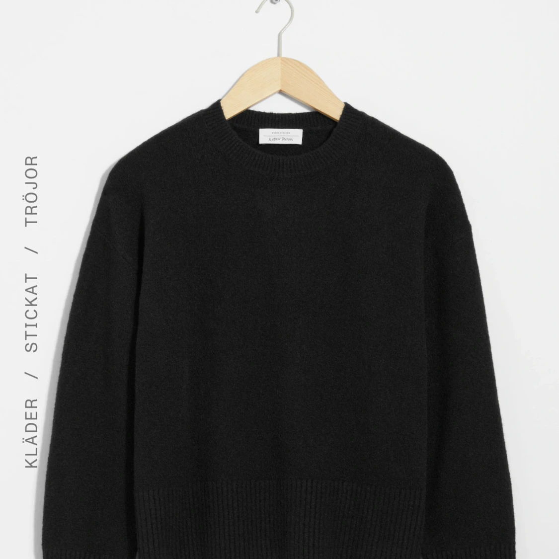 Svart stickad tröja