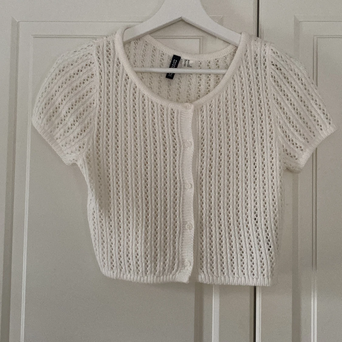 Vit stickad topp från H&M