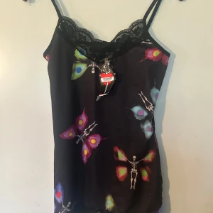 Linne fr Insanity S/M - Helt nytt linne fr Insanity. Storlek S/M. Lite stretchigt.