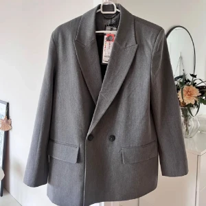 Grå kavaj  - Snygg grå kavaj.