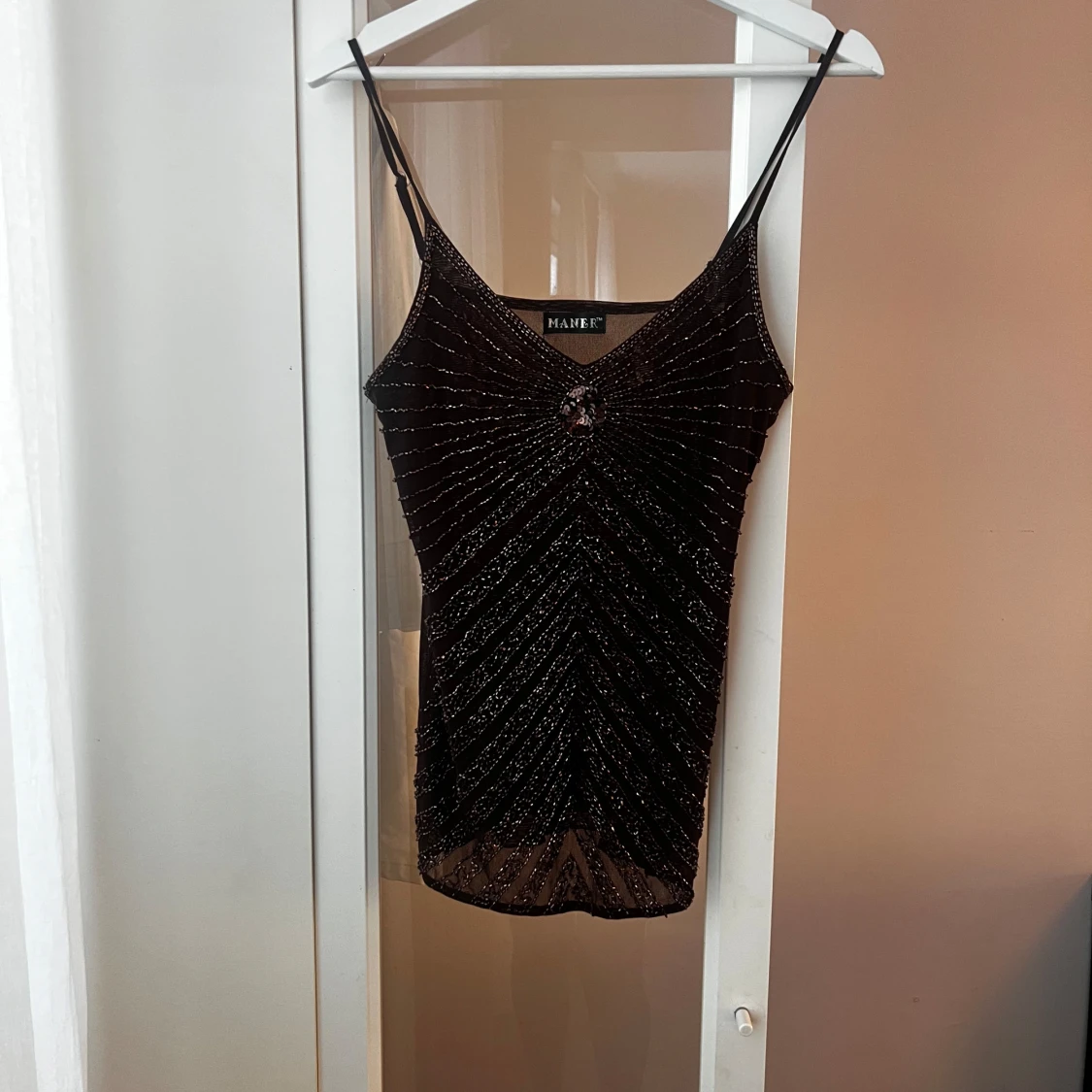 Brun glittrig linnetopp  - 1