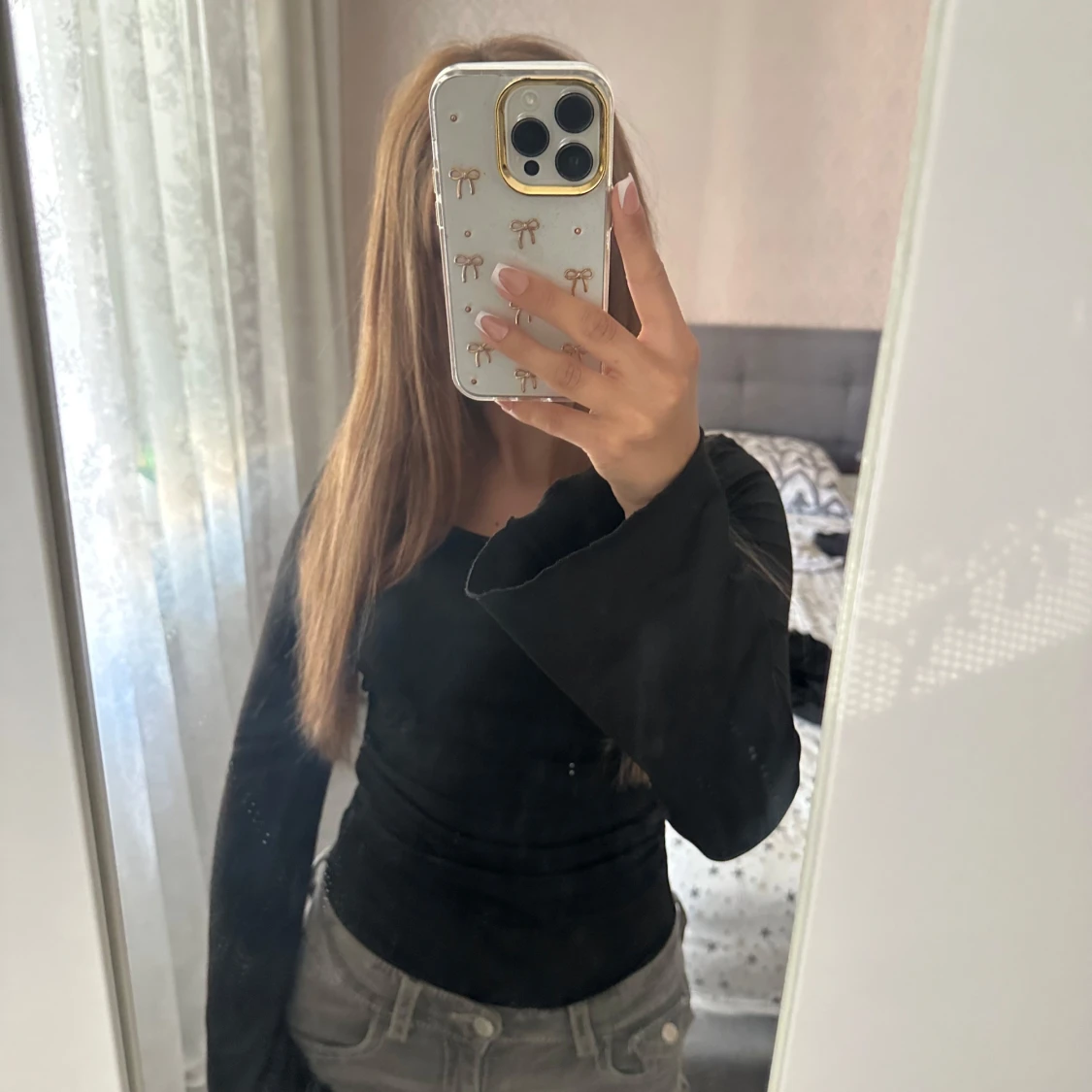 Svart långärmad body storlek S