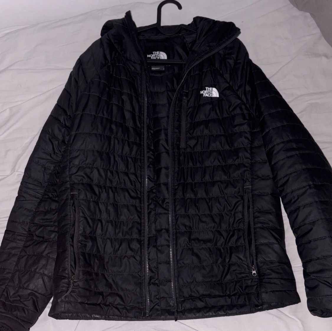 Svart dunjacka från The North Face