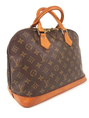 Louis Vuitton Alma Monogram - Very Good Condition. Inside is also very clean.   Serial Number: BA0925 (February 1995 in France) Height: 25 cm / 9.8 Inches Width: 16 cm / 6.3 Inches Length: 32 cm / 12.6 Inches